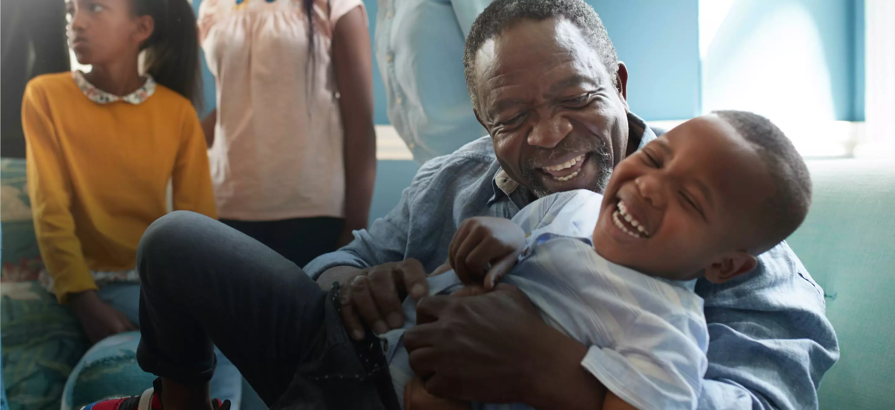 father playing with children